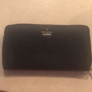 Kate Spade cowhide leather wallet, black with gold tone zipper.